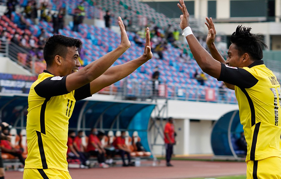 Cầu thủ Malaysia ăn mừng khi thắng Lào 4-0 tại Singapore ngày 9/12.